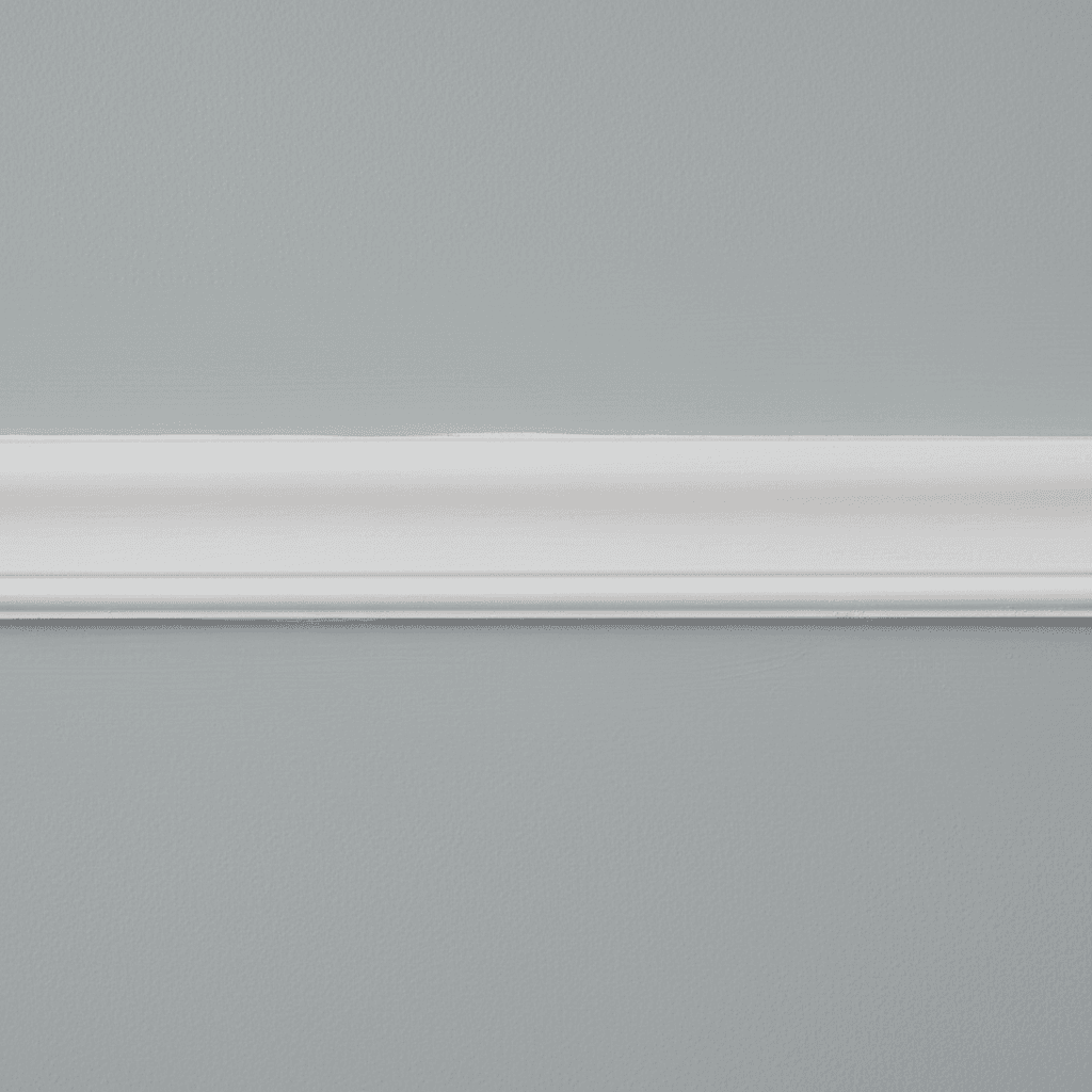 Close-up of a clean paint line where wall meets white trim