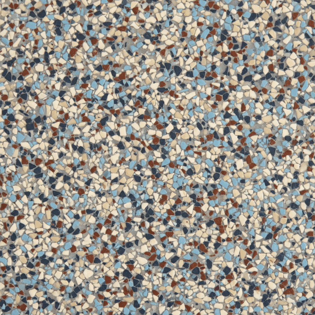 Close-up of a textured epoxy floor surface with vinyl color chips