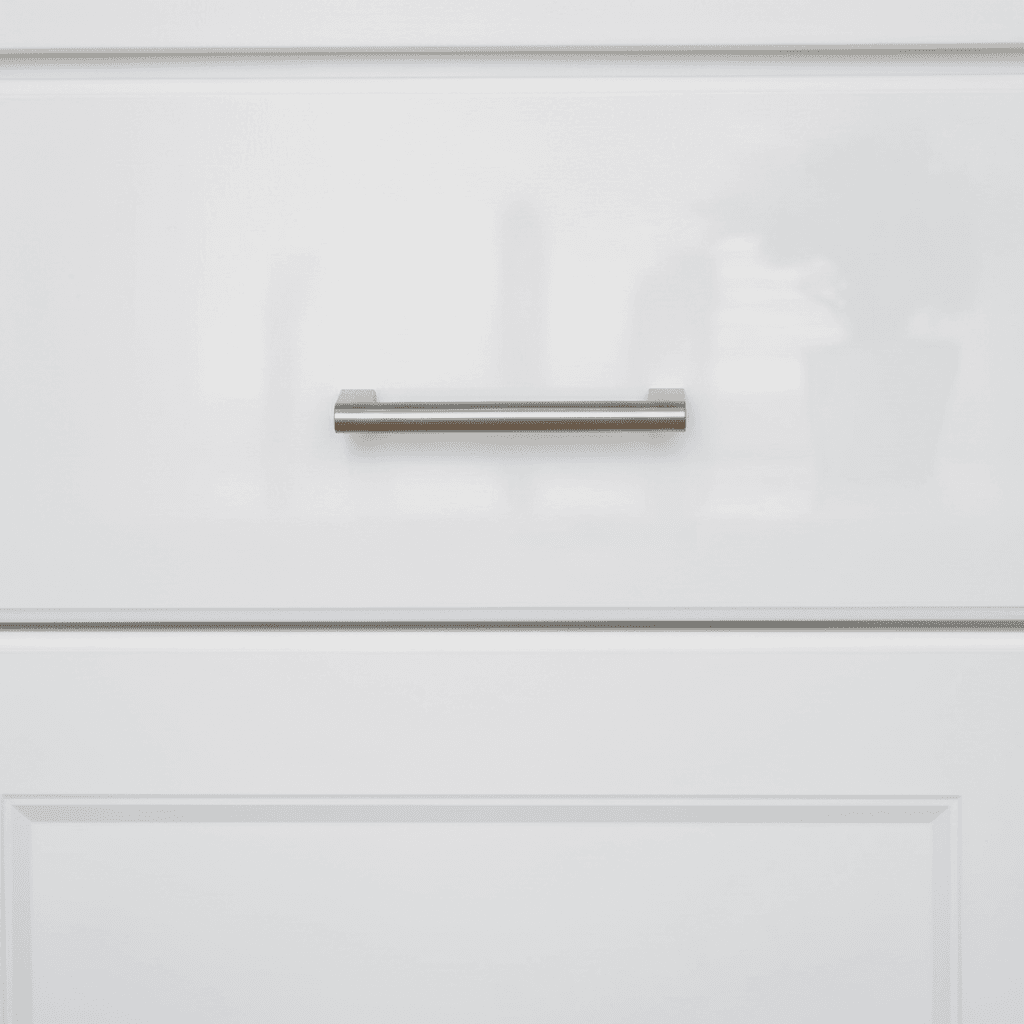 Close-up of a freshly painted white kitchen cabinet with a smooth finish